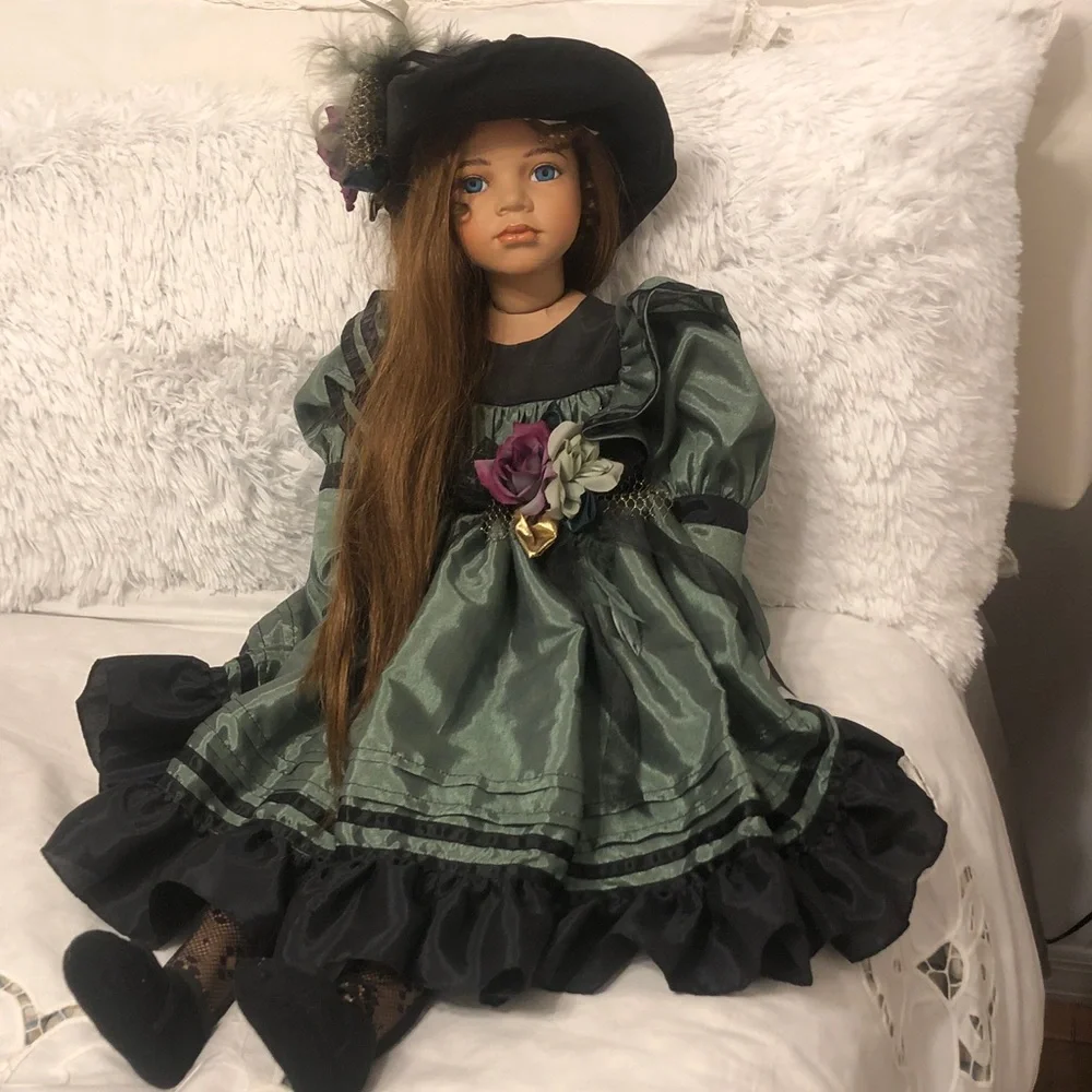 Vintage-Style Green & Black Porcelain Doll with Floral Accent